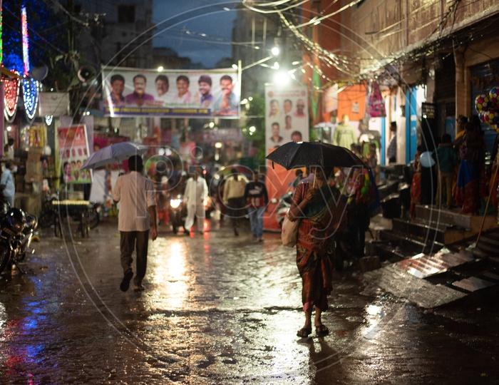 Pedestrians Using Umbrellas Covering From Rain in Hyderabad City