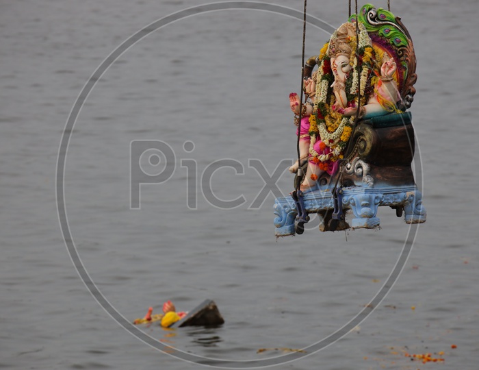 Ganesh  Idols on Cranes  For Immersion in Hussain Sagar Lake  During Ganesh Visarjan Or Nimarjan  Event  At Tankbund In Hyderabad