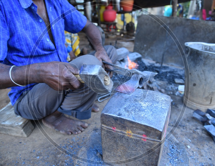 Indian Blacksmith Shaping the Hot Metal using Hammer