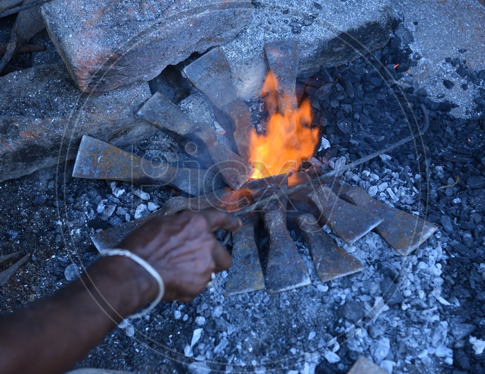 Indian Blacksmith Forges the Hot Metal