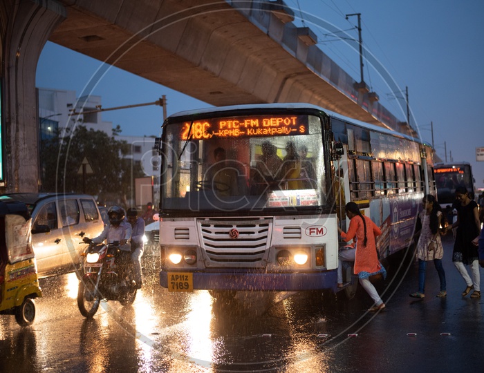 Young Girl Boarding  City Bus In Hyderabad Amidst Heavy Rain in Monsoon