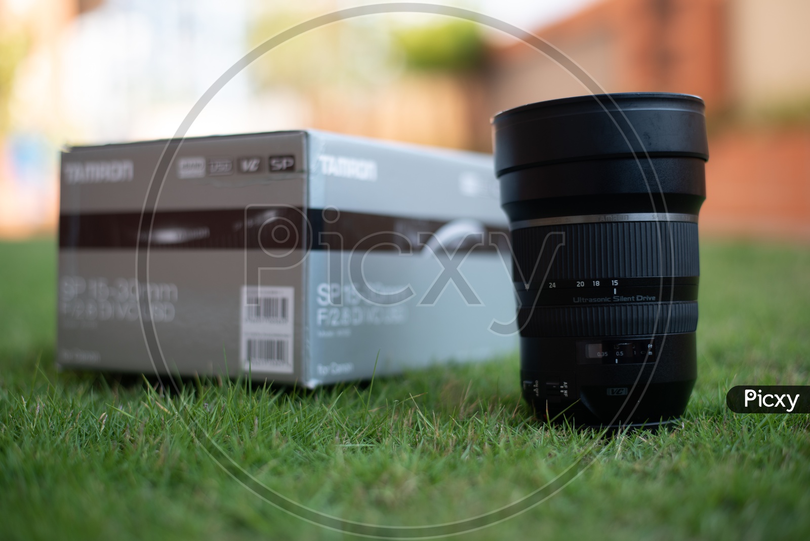 Tamron Sigma 15-30 mm DSLR Lens On Lawn Garden Grass Backdrop