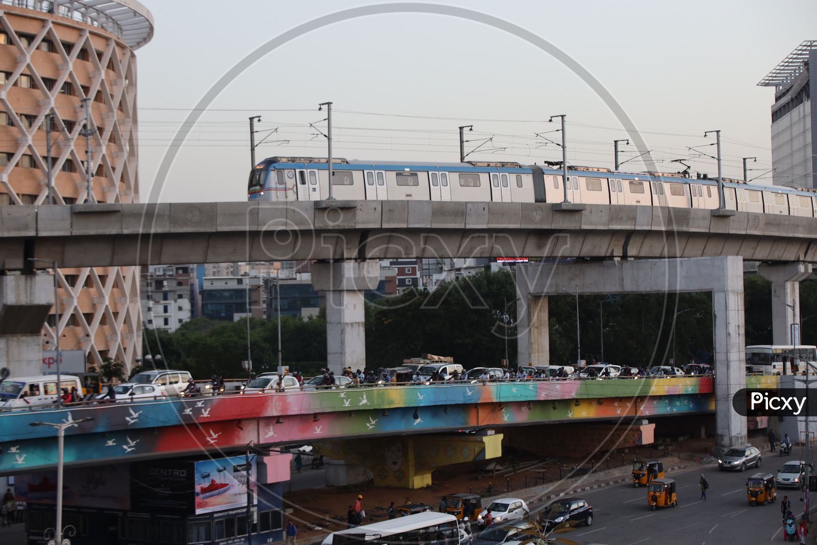 Metro Train Running on Track With Hitech City Flyover Composition