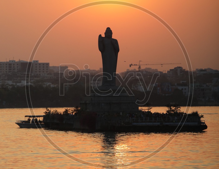 Buddha Statue In Hussain Sagar Lake  With Sunset Sky in Background