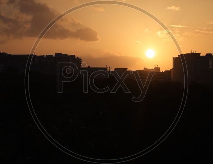 Silhouette of High rise Buildings With Sunset Background