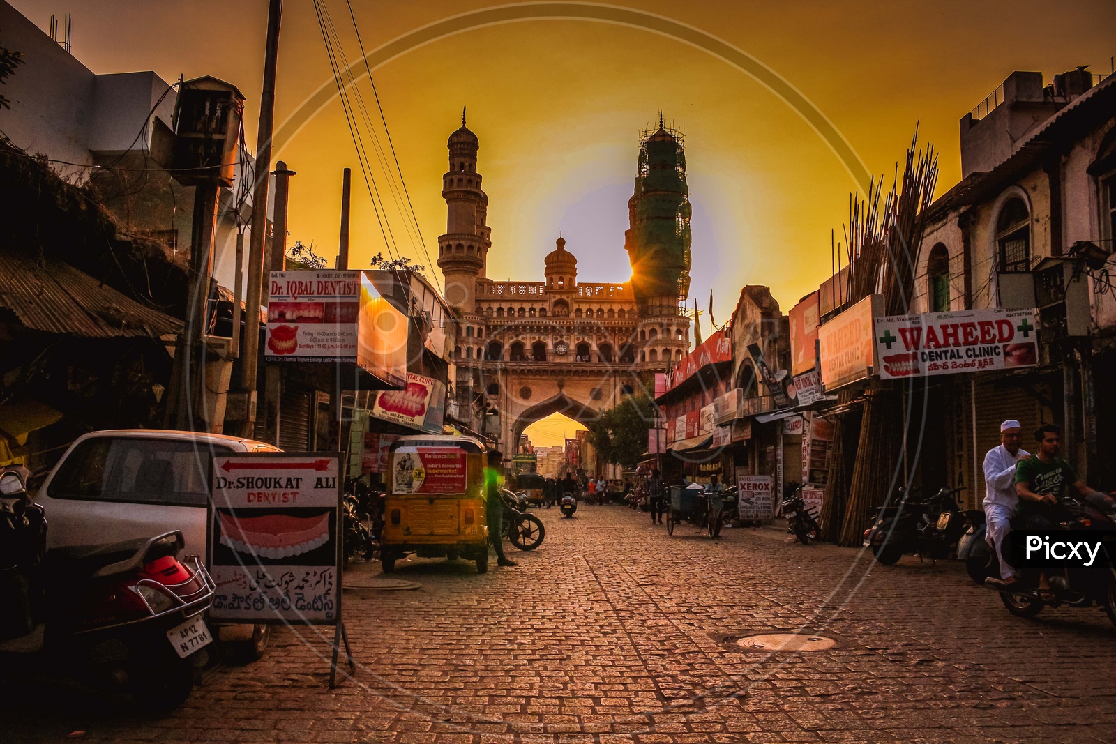 A View Of Charminar With Streets And Golden light Over Charminar