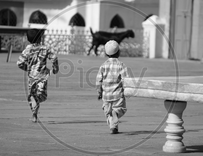 Muslim Boy Playing   In Mecca Masjid Compound