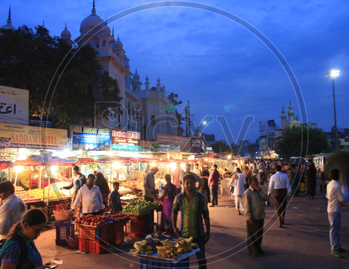 Busy Charminar Street With Street Food Stalls