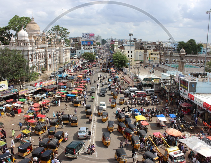 Aerial View Of Charminar Streets With  Visitors And Commuting Vehicles and Autos
