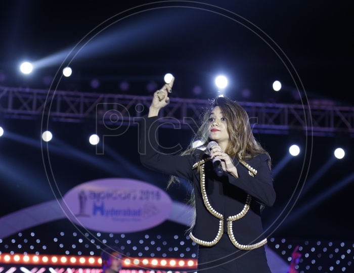 Beautiful Woman Performing Live Singing On Stage At APICON 2016 Event in Hyderabad