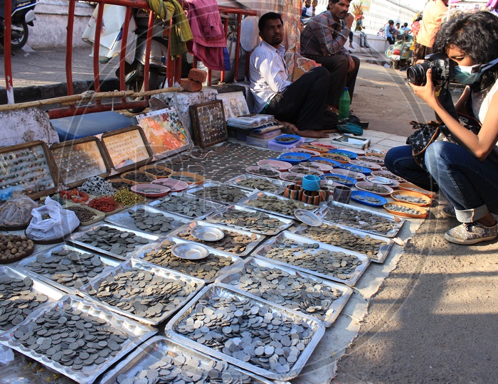 Various Vintage Coins Selling At a Road Side Stall Near Charminar