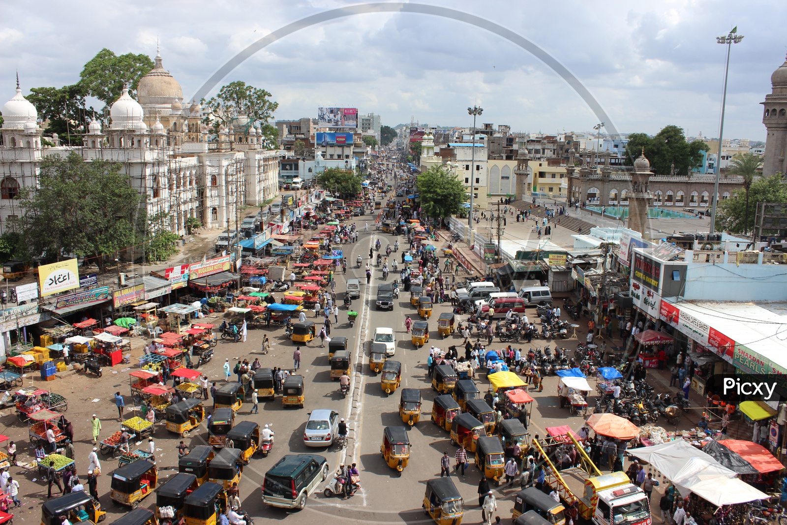 Aerial View Of Charminar Streets With  Visitors And Commuting Vehicles and Autos