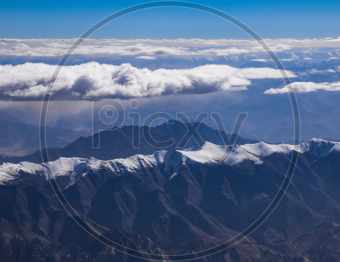 Aerial View Of Mountain Valleys And Nanda Devi Hills From Flight Window