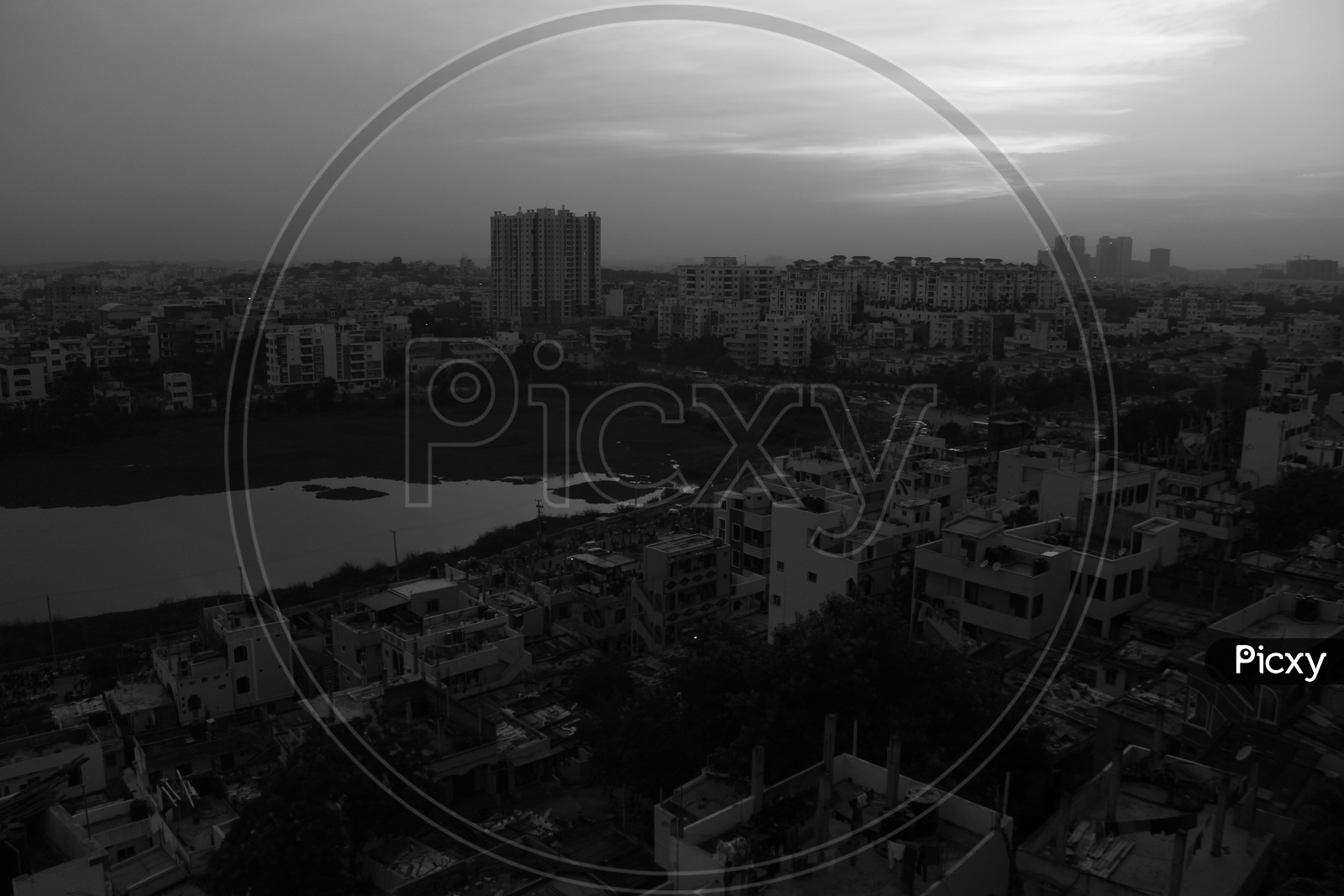 Sunset Over High Rise Buildings Scape With Bright Sky Background in Monochrome Filter