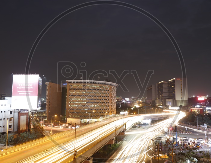 Cyber Towers  With Long Exposure of Light Trail Of Moving Vehicles Over  Hi-Tech City Flyover And At Signal