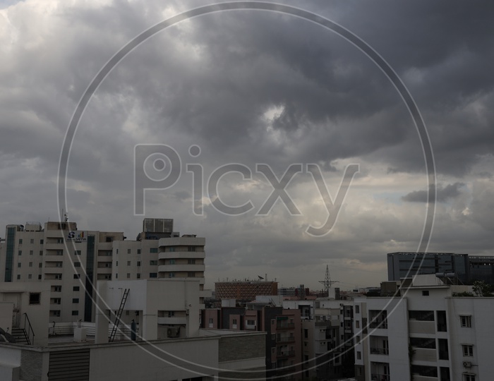 Hyderabad City Scape With High Rise Buildings  And Dark Storm Clouds