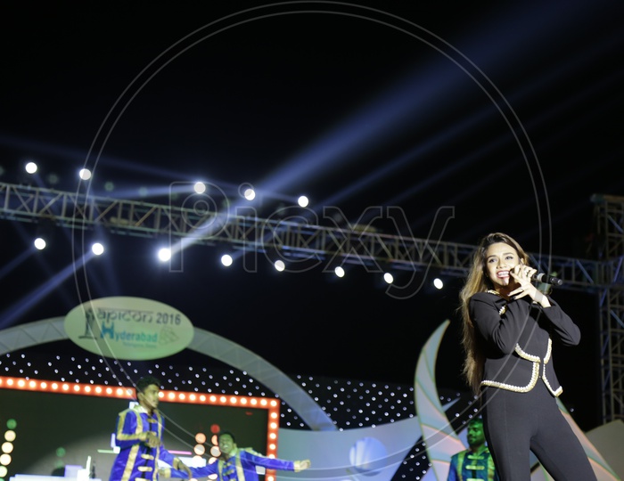 beautiful Girl Performing Live On Stage Singing And Dancing At a Concert At APICON 2016  In Hyderabad
