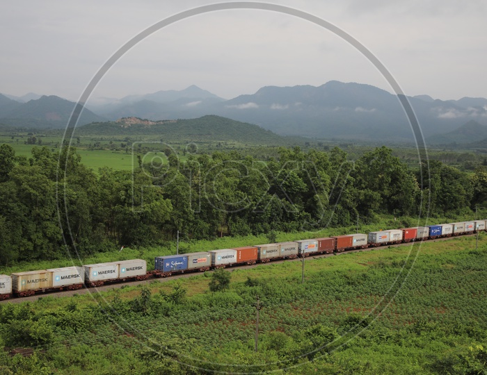 Aerial View Of Indian Railway Train Running On Track At a Rural Area