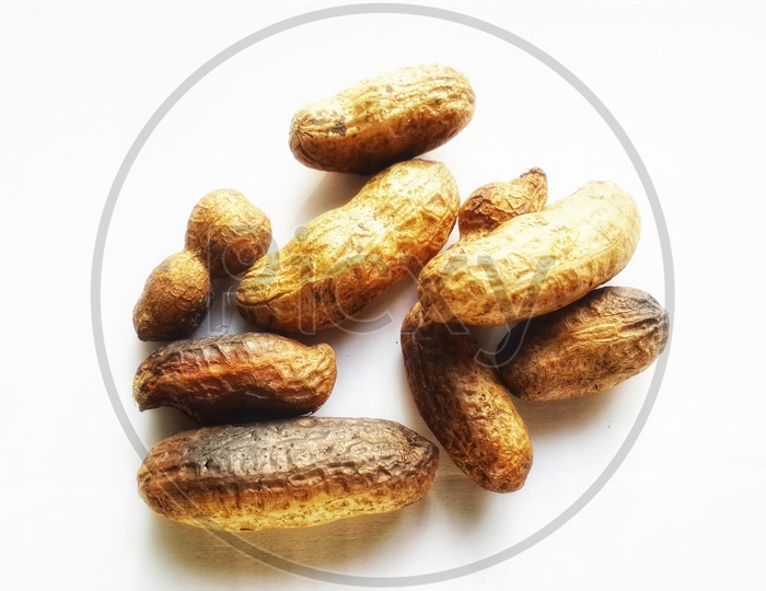 roasted groundnuts isolated on white background.selective focus shot from above