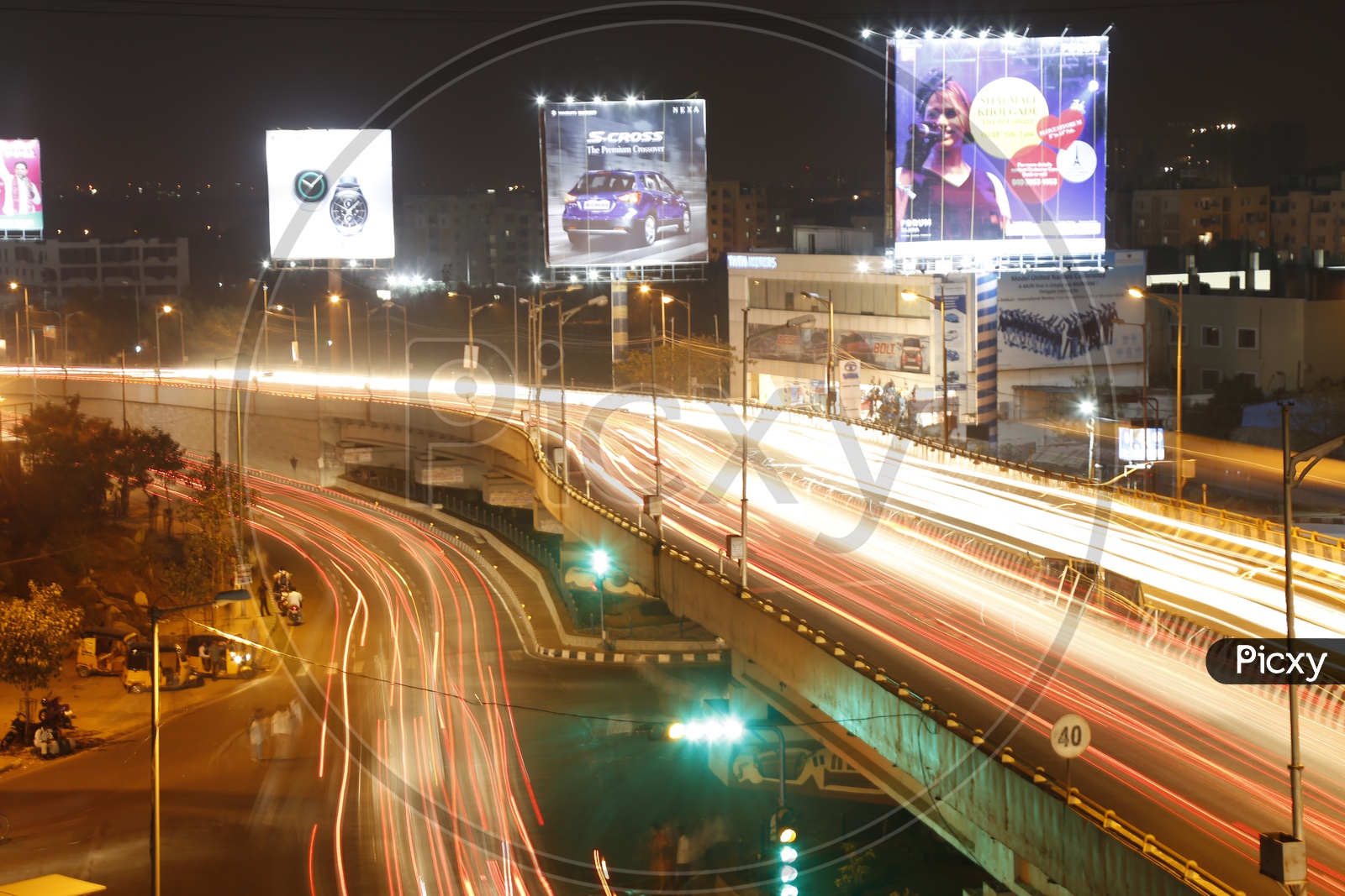 Long Exposure Shot Of Fast Moving Vehicles On Hi-Tech City Flyover With Light trails