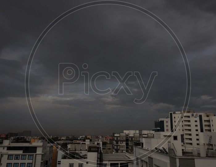 Hyderabad City Scape With High Rise Buildings  And Dark Storm Clouds