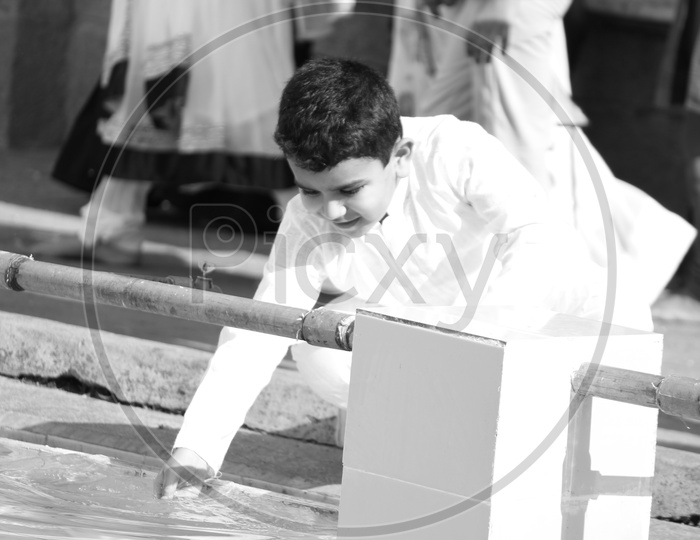 Young Muslim Boy Doing Ritual Cleaning Before  Namaz  At Mecca Masjid