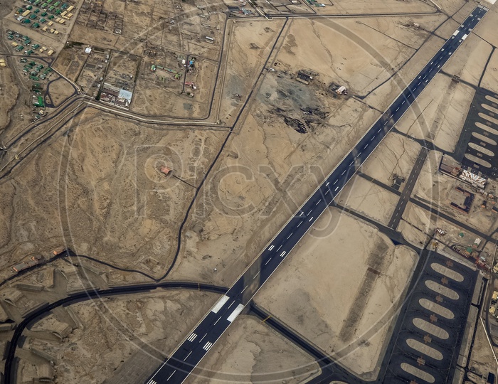 Aerial View Of Leh Airport With Runway And Airport Terminal From Flight Window