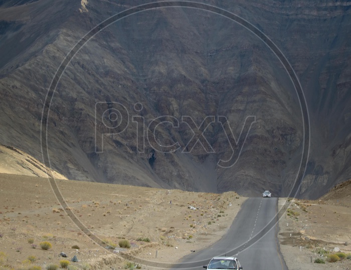 Cars In The Roads Leading To Mountains In Ladakh