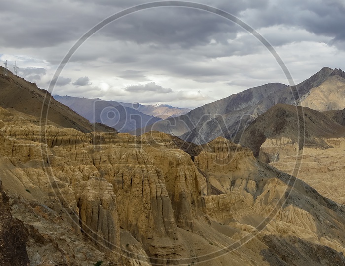 Sedimentary Soil Dunes With Mountains Backdrop At Ladakh