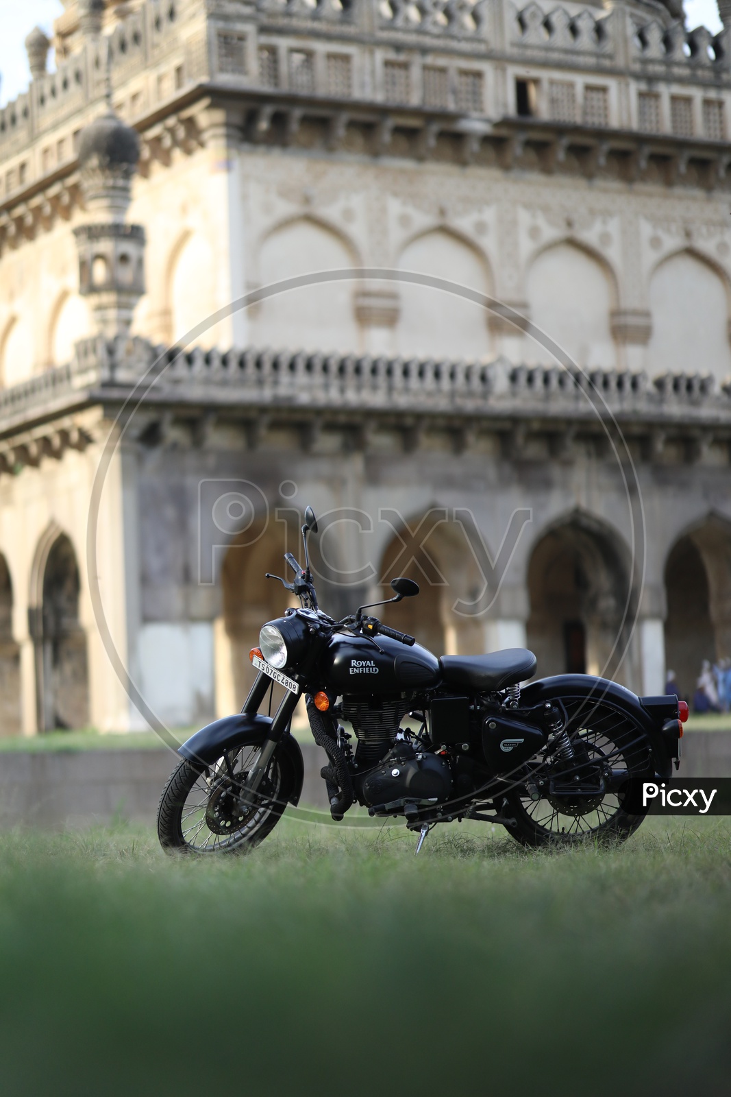 Royal Enfield Bullet 350 Classic Bike With Qutub Shahi Tomb In Background