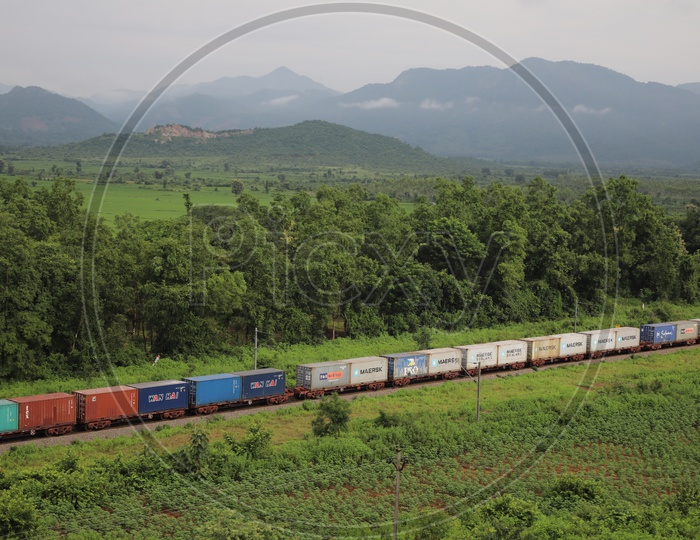 Aerial View Of Indian Railway Train Running On Track At a Rural Area