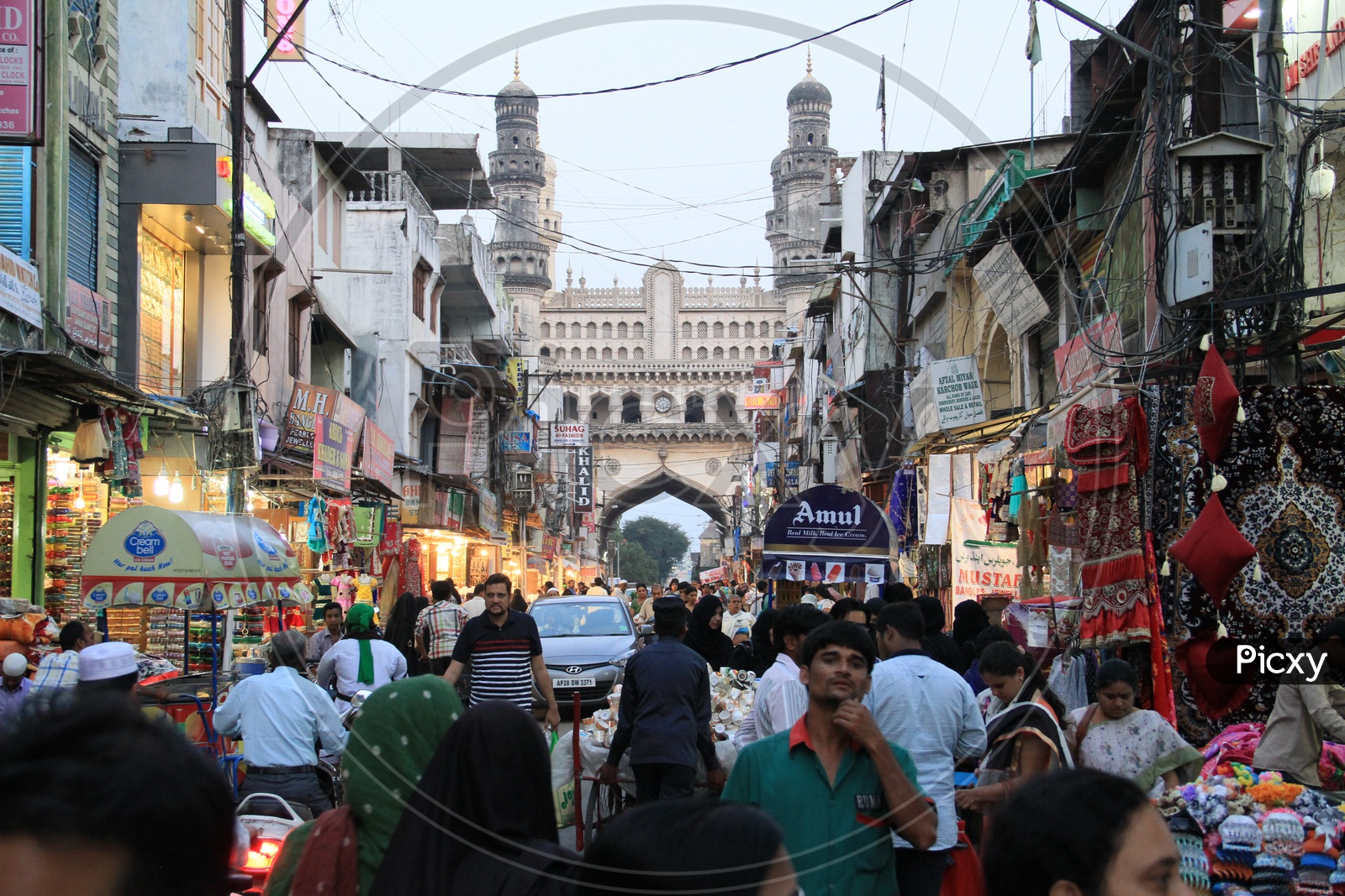 Busy Ghansi Bazaar Street With Visitors Shopping In Bangle Shops With Charminar In Background