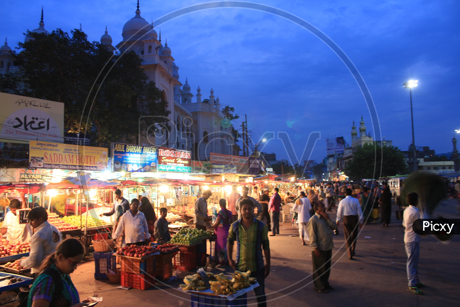 Busy Charminar Street With Street Food Stalls