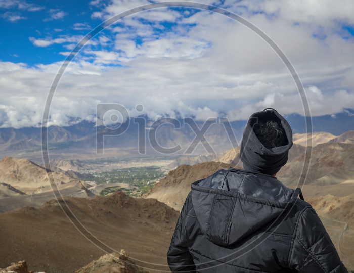 Photographers Or Travelers In Ladakh With Mountain Backdrop