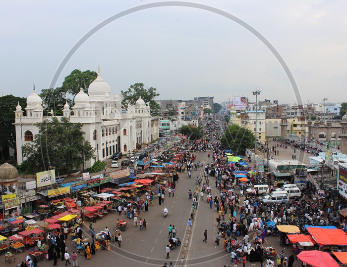 Aerial View Of Streets Around Charminar With Visitors And Vehicles Moving Around It