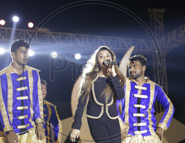 beautiful Girl Performing Live On Stage Singing And Dancing At a Concert At APICON 2016  In Hyderabad