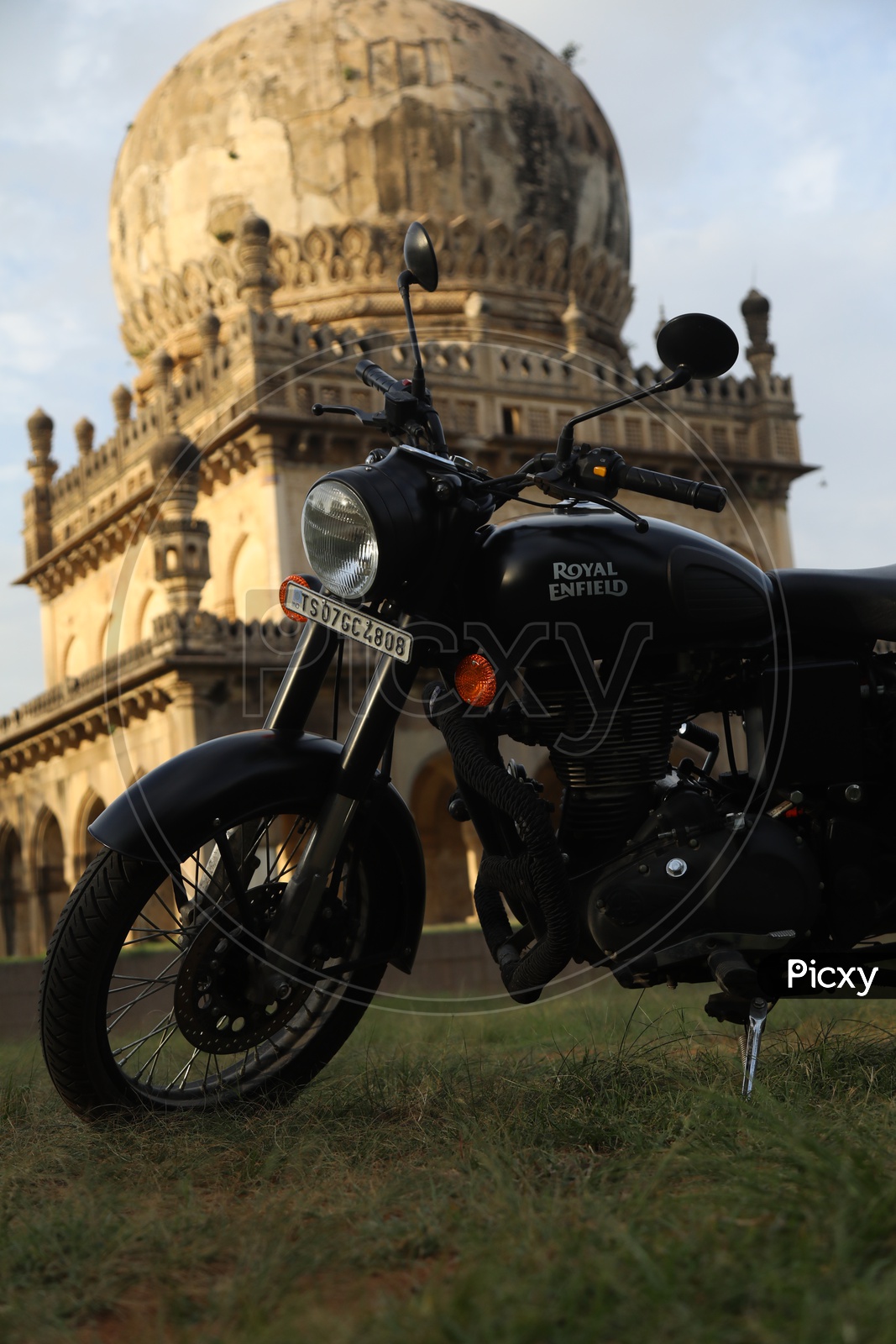 Royal Enfield Bullet 350 Classic Bike With Qutub Shahi Tomb In Background