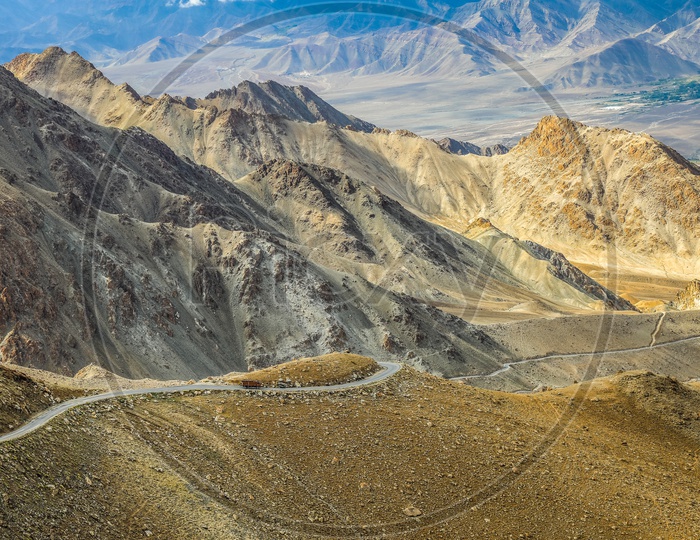 Roads In Ladakh  Valleys With Snow Capped Mountains in background