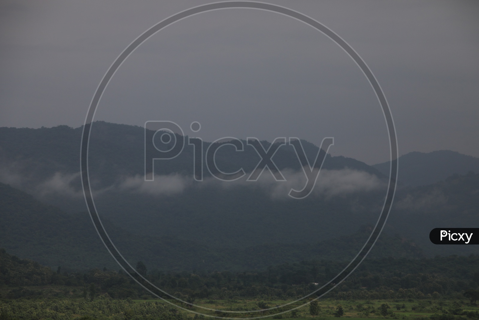 Landscape Of Green Plateaus And  Terrain Hills Filled With Fog