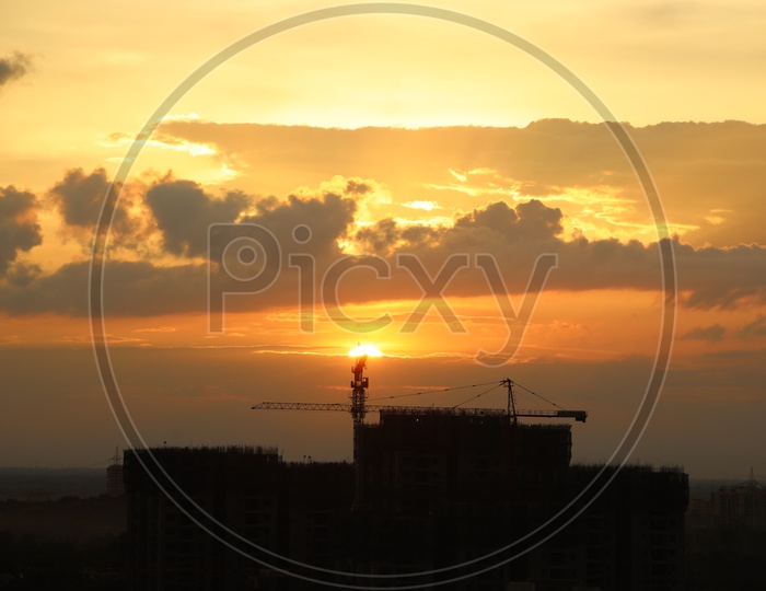 Silhouette Of  High Rise Buildings Over City Scpae With Sunset  Sky Background
