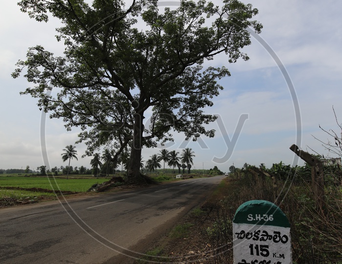Mile Stone Besides Roads With Distance Indication At Indian Rural Villages
