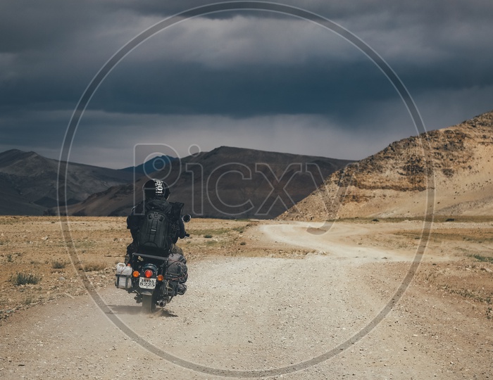 Bike travelers Riding On Mud Roads Of Ladakh