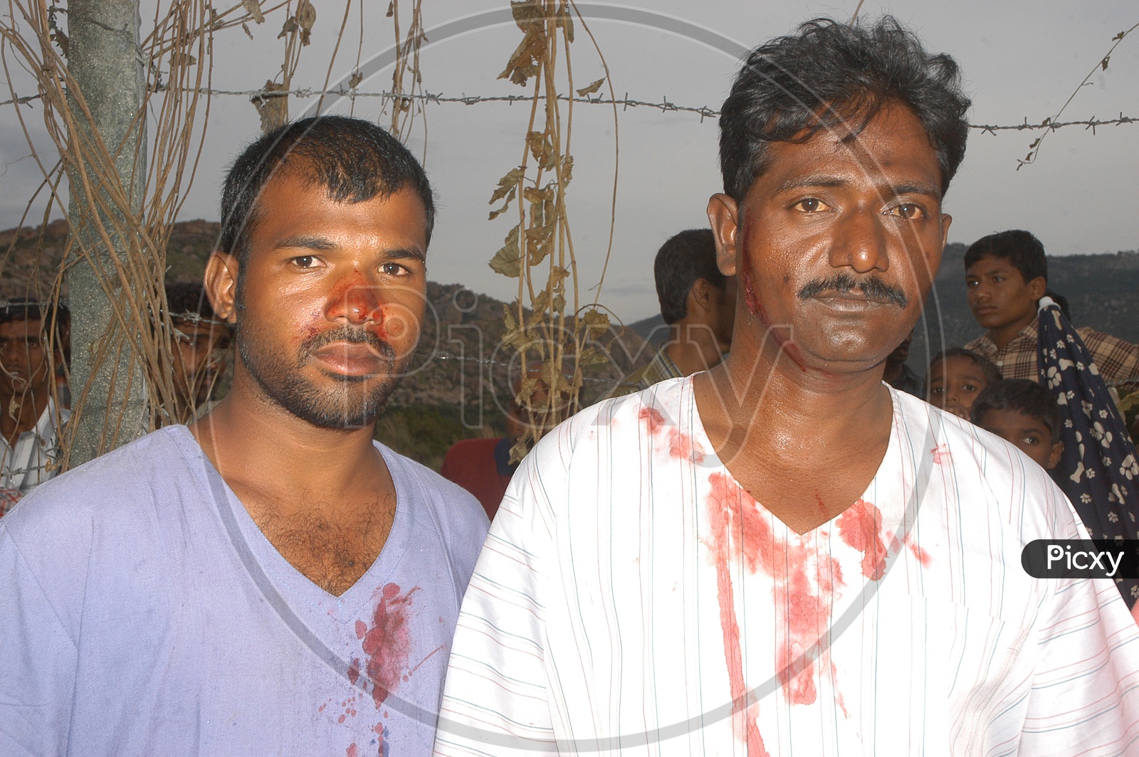 Telugu Movie Artists with Dummy Blood on Shirts while Shooting
