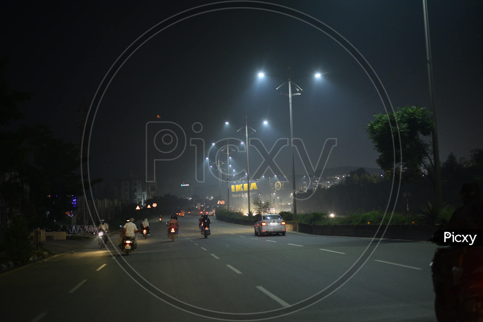 Image of Commuting Vehicles On Hyderabad City Roads At Night-FT846042-Picxy