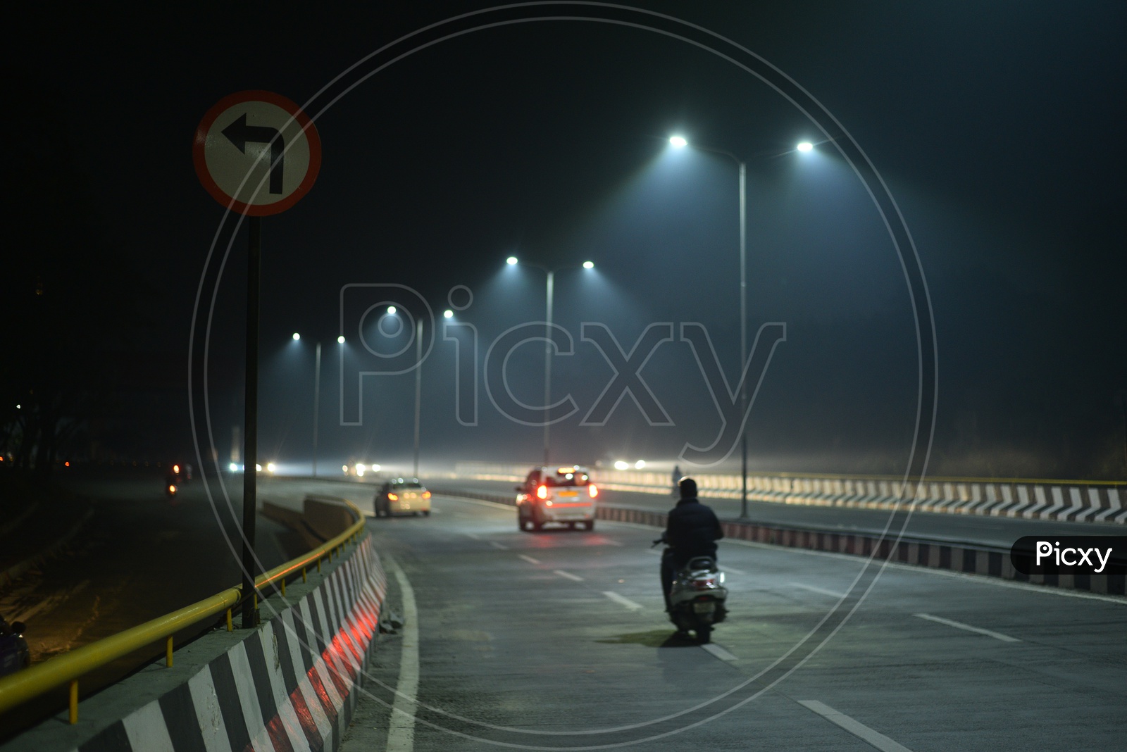 Bike Commuters On A Smog Filled roads During Diwali Night