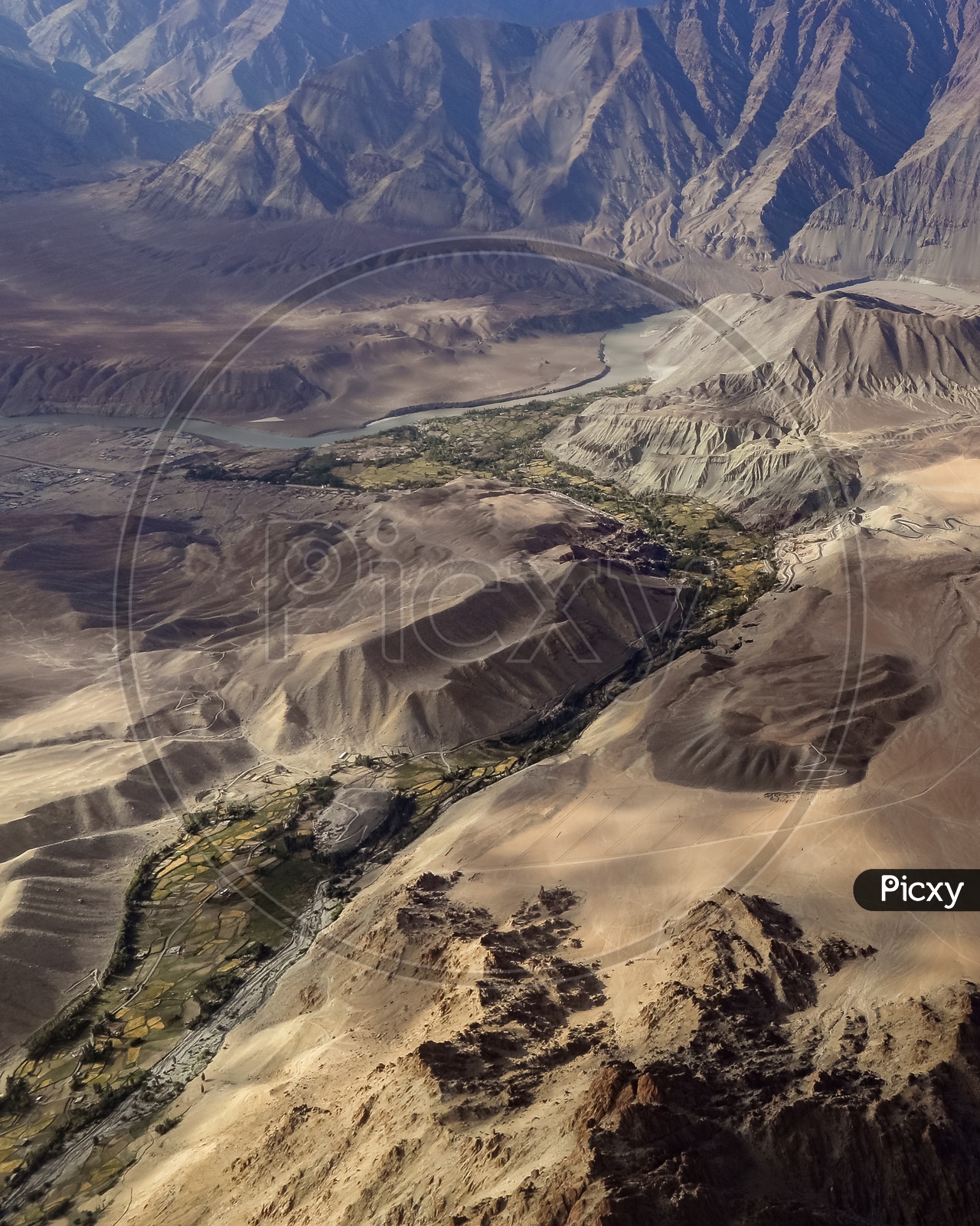 Aerial View Of River Valleys Between Sand Dunes In Ladakh From Flight Window