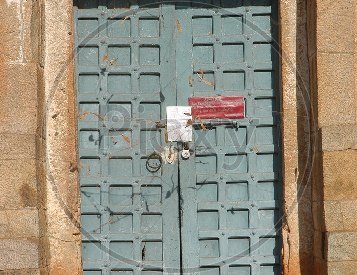 Seize Lock To an Ancient Temple Door With Court Notice Attached