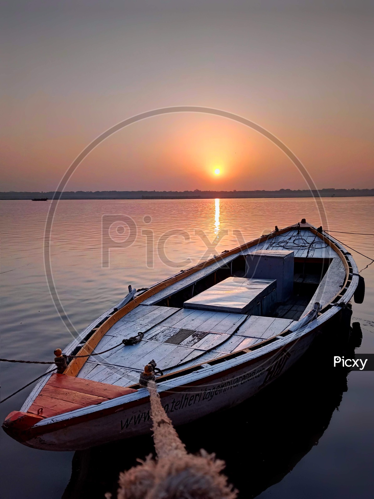 Docked boat with sunrise