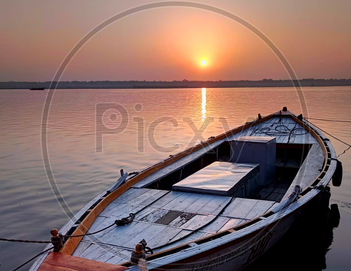 Docked boat with sunrise