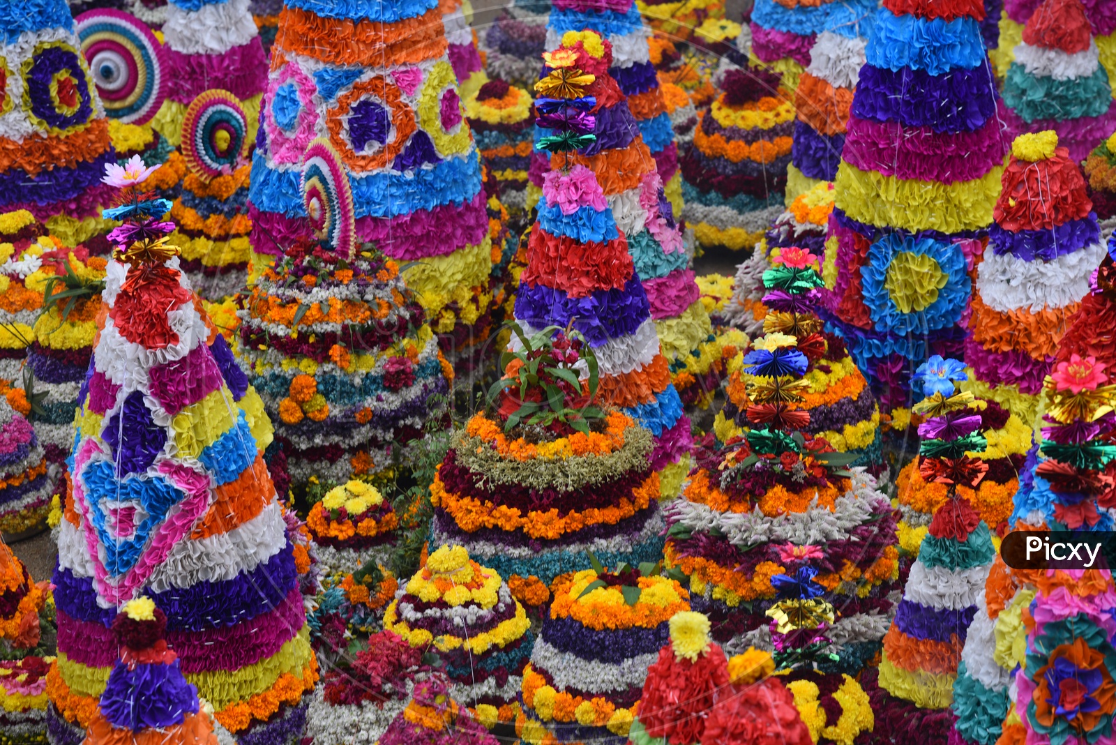Bathukamma, a floral decoration made from medicinal flowers and fragrances arranged like a temple gopuram.